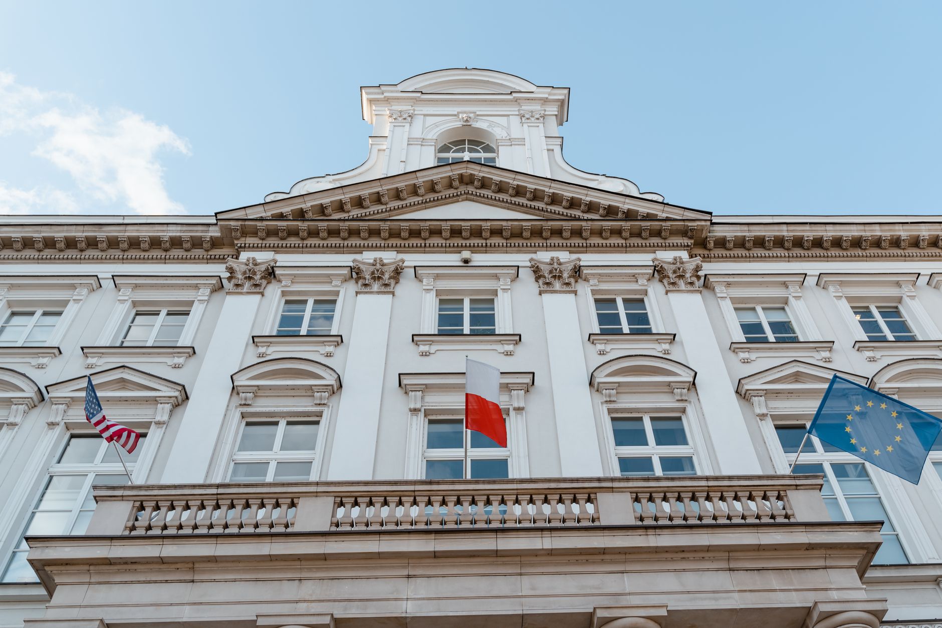 Classic building facade with multiple international flags