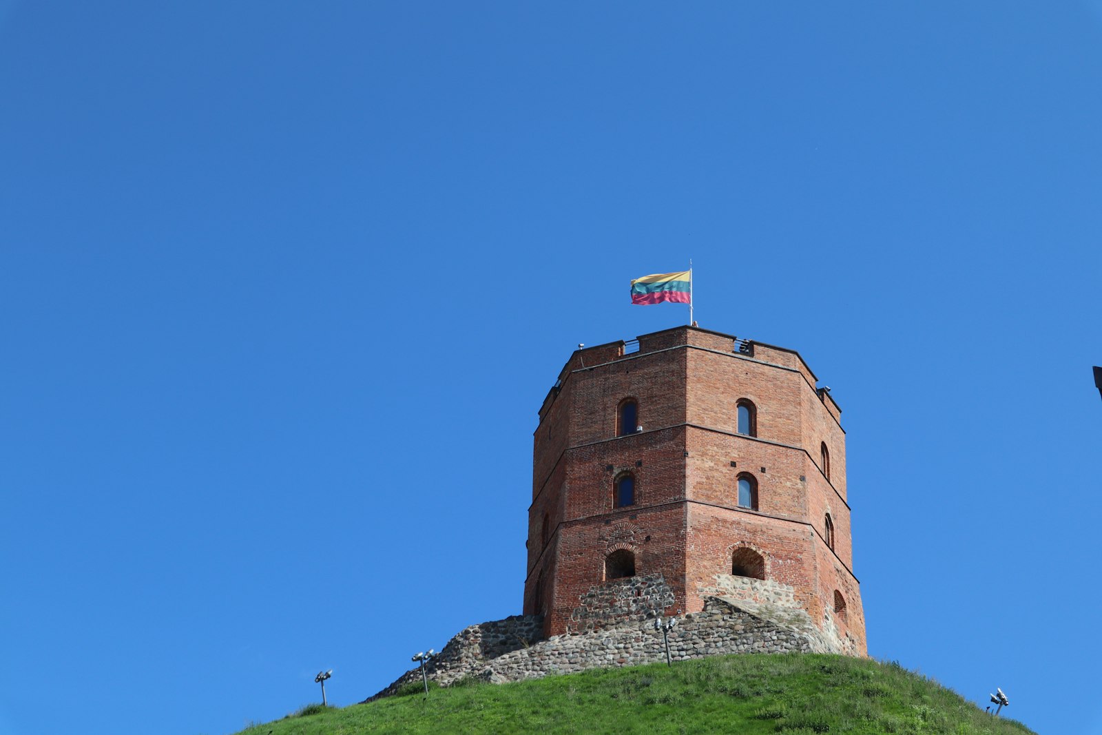 Gediminas Tower with the Lithuanian flag on Vilnius castle hill